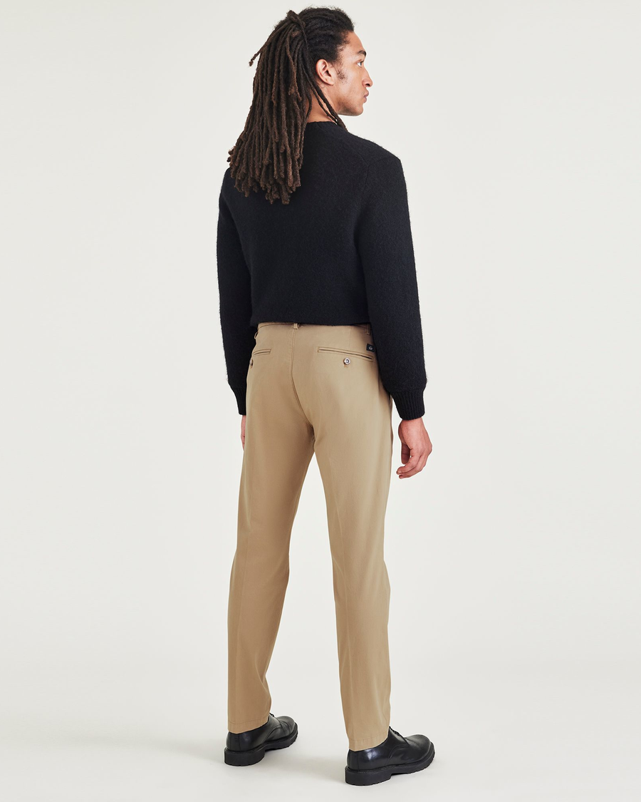 Back view of model wearing Harvest Gold Crafted Trousers, Slim Tapered Fit.