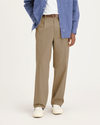 Front view of model wearing Harvest Gold Eighty-Six Original Pleated Chinos, Loose Fit.