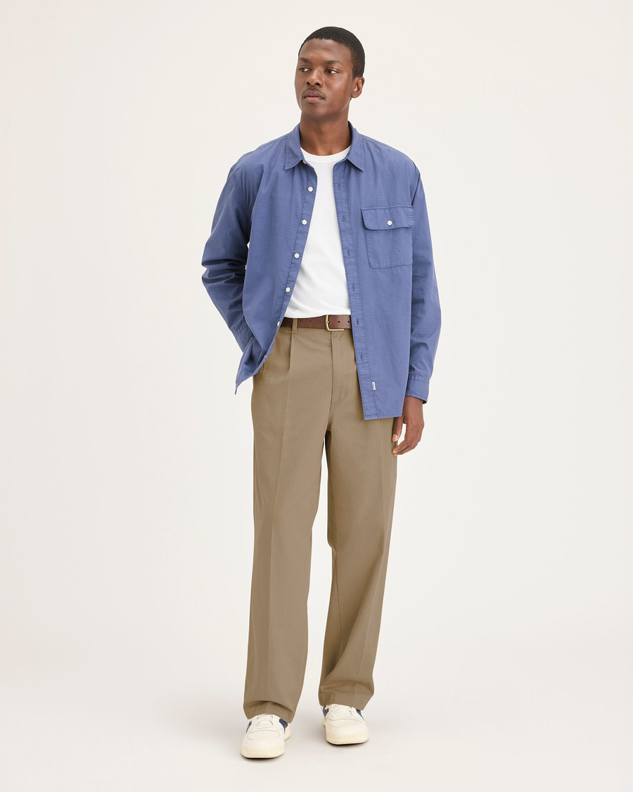 Front view of model wearing Harvest Gold Eighty-Six Original Pleated Chinos, Loose Fit.