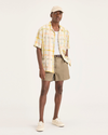 Front view of model wearing Harvest Gold Eighty-Six Pleated Short.