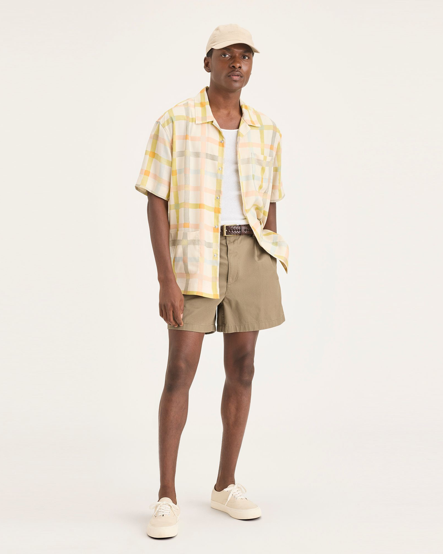 Front view of model wearing Harvest Gold Eighty-Six Pleated Short.