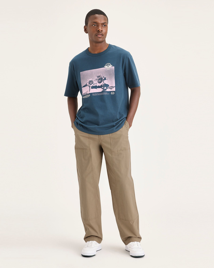 Front view of model wearing Harvest Gold Eighty-Six Utility Pants, Loose Fit.