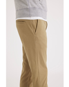 Side view of model wearing Harvest Gold Go Lifestyle Chino, Skinny Fit.