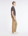 Side view of model wearing Harvest Gold Original Chinos, Slim Fit.