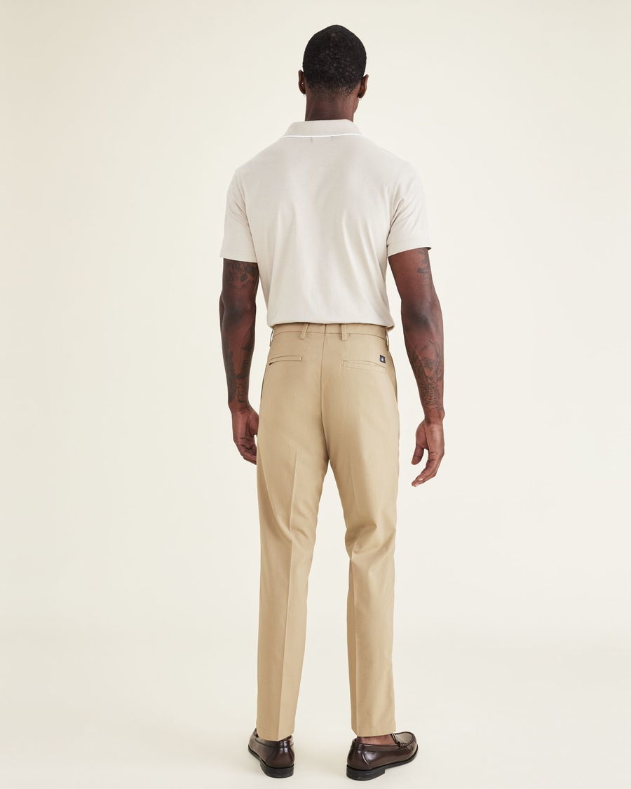 Back view of model wearing Harvest Gold Signature Go Khakis, Slim Fit.