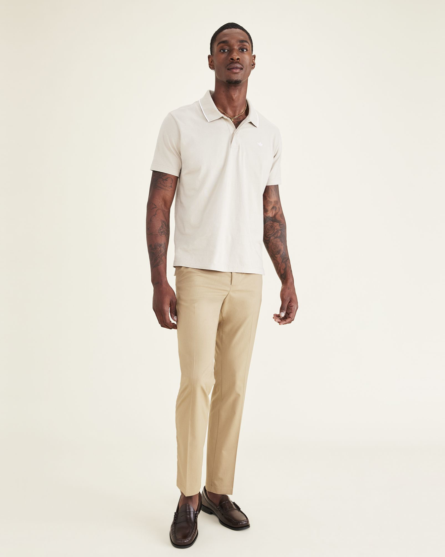 Front view of model wearing Harvest Gold Signature Go Khakis, Slim Fit.