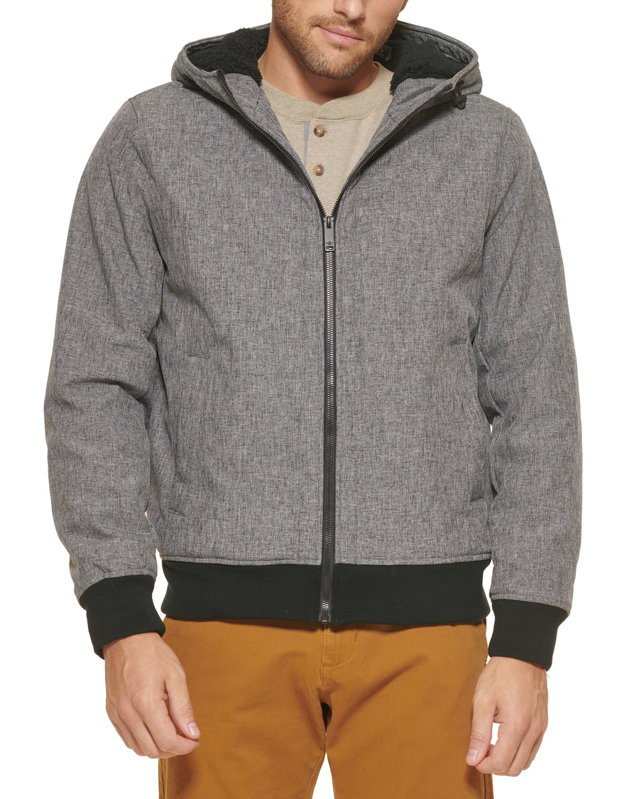 Front view of model wearing Heather Grey Zip Up Softshell Hoodie.