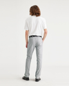Back view of model wearing High Rise City Tech Trousers, Slim Fit.