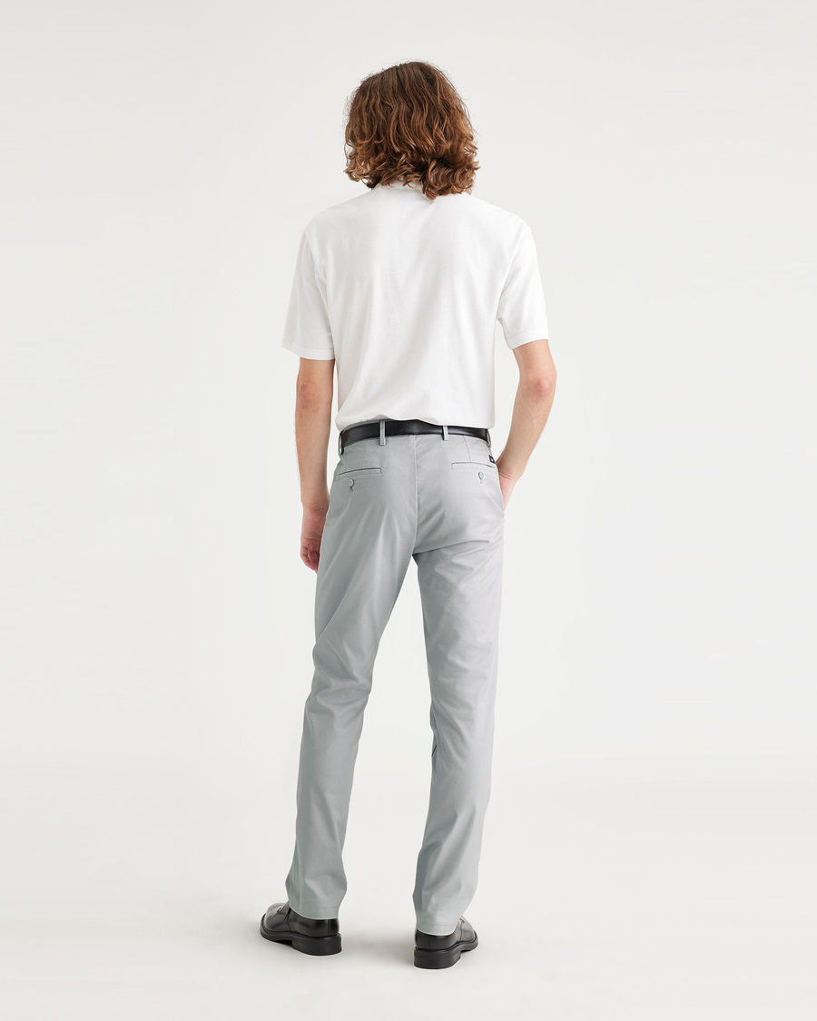 Back view of model wearing High Rise City Tech Trousers, Slim Fit.