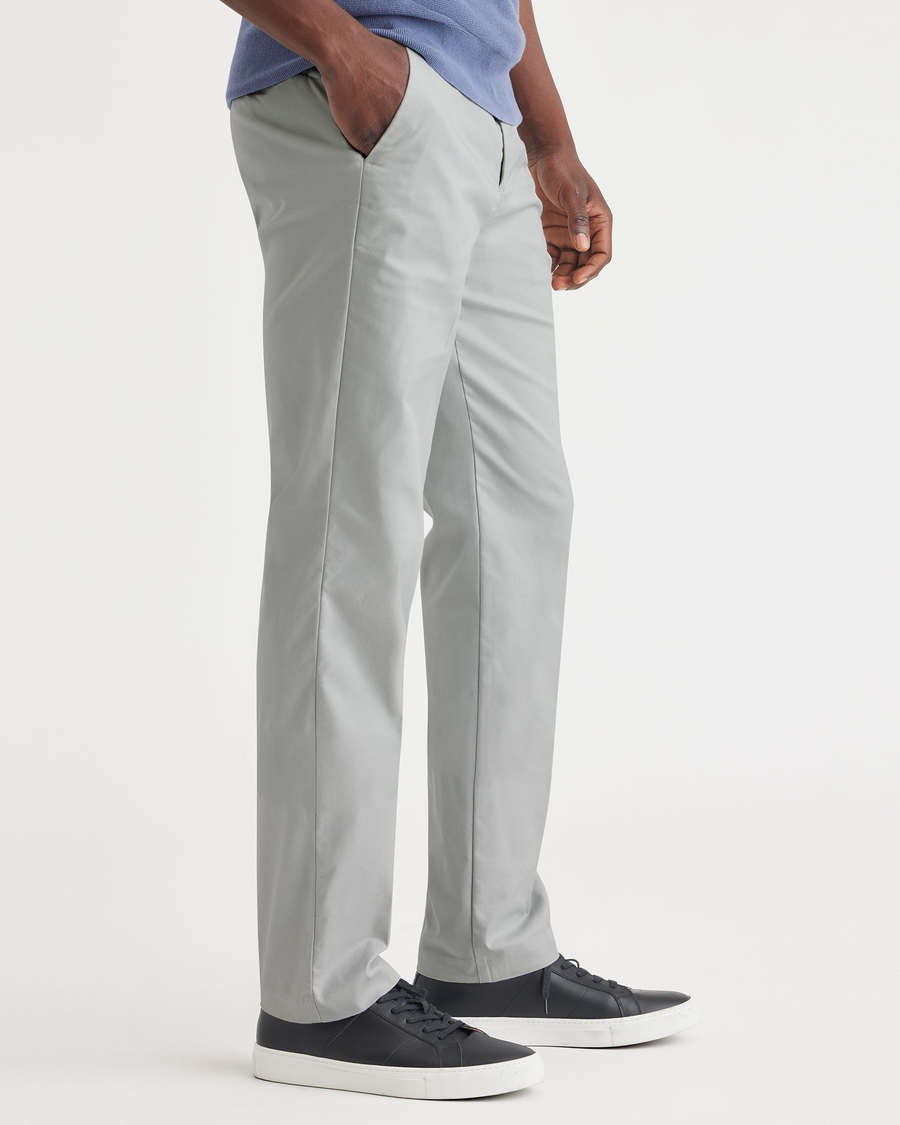 Side view of model wearing High Rise City Tech Trousers, Straight Fit.