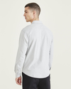 Back view of model wearing High-Rise Knit Button-Up Shirt, Regular Fit.