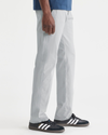 Side view of model wearing High Rise Ultimate Chinos, Athletic Fit.