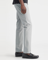 Side view of model wearing High Rise Ultimate Chinos, Slim Fit.
