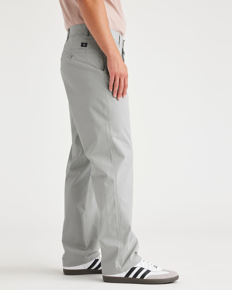 Side view of model wearing High Rise Ultimate Chinos, Straight Fit.