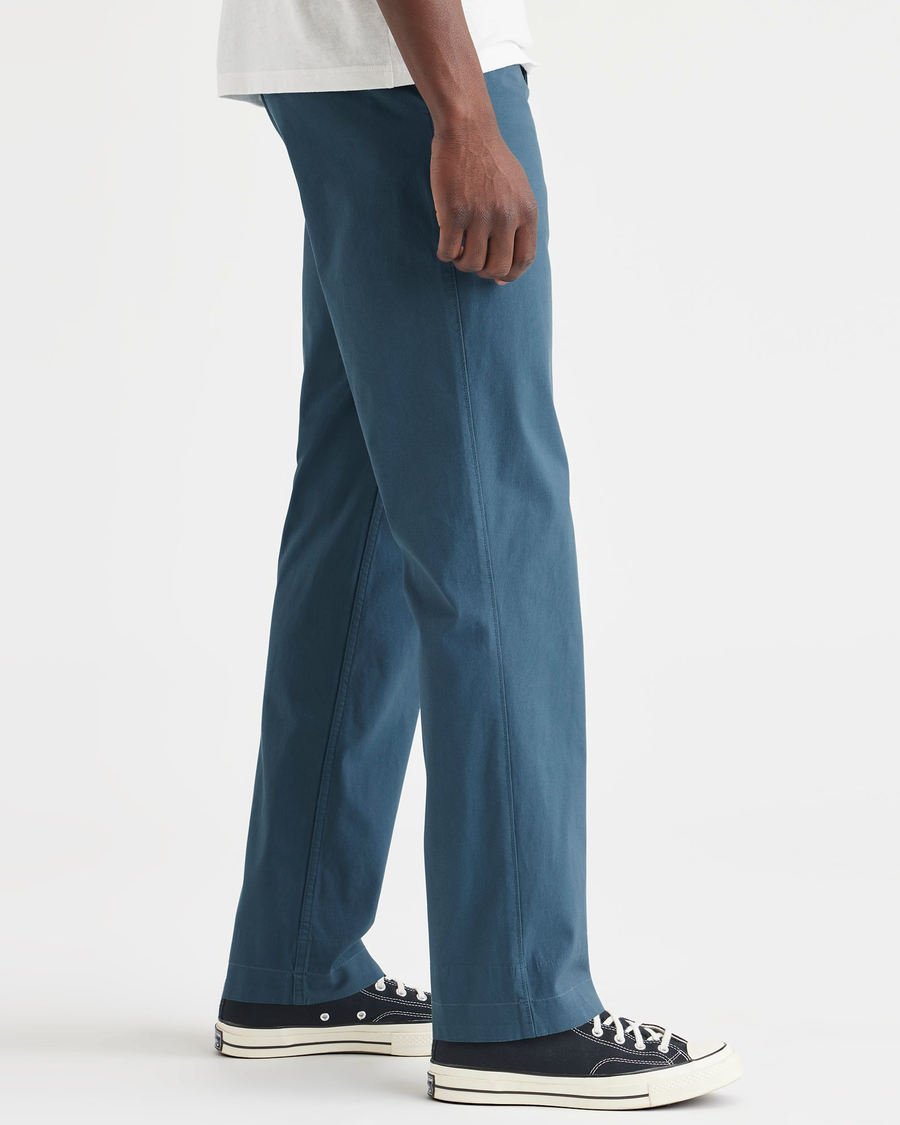 Side view of model wearing Indian Teal California Khakis, Straight Fit.