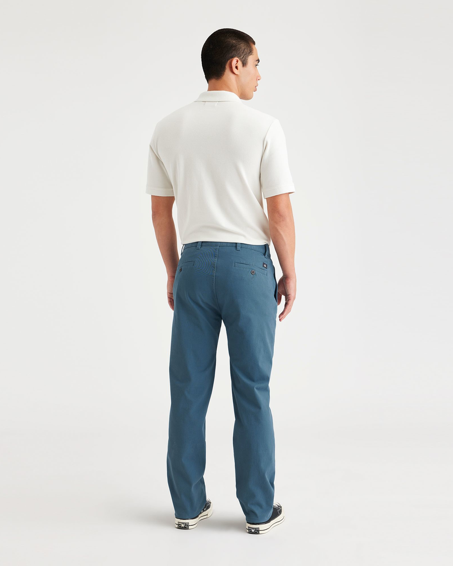 Back view of model wearing Indian Teal Ultimate Chinos, Slim Fit.