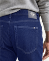 View of model wearing Indigo Stonewash Jean Cut Pants, Straight Fit.