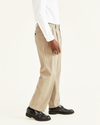 Side view of model wearing Khaki Easy Khakis, Pleated, Classic Fit.