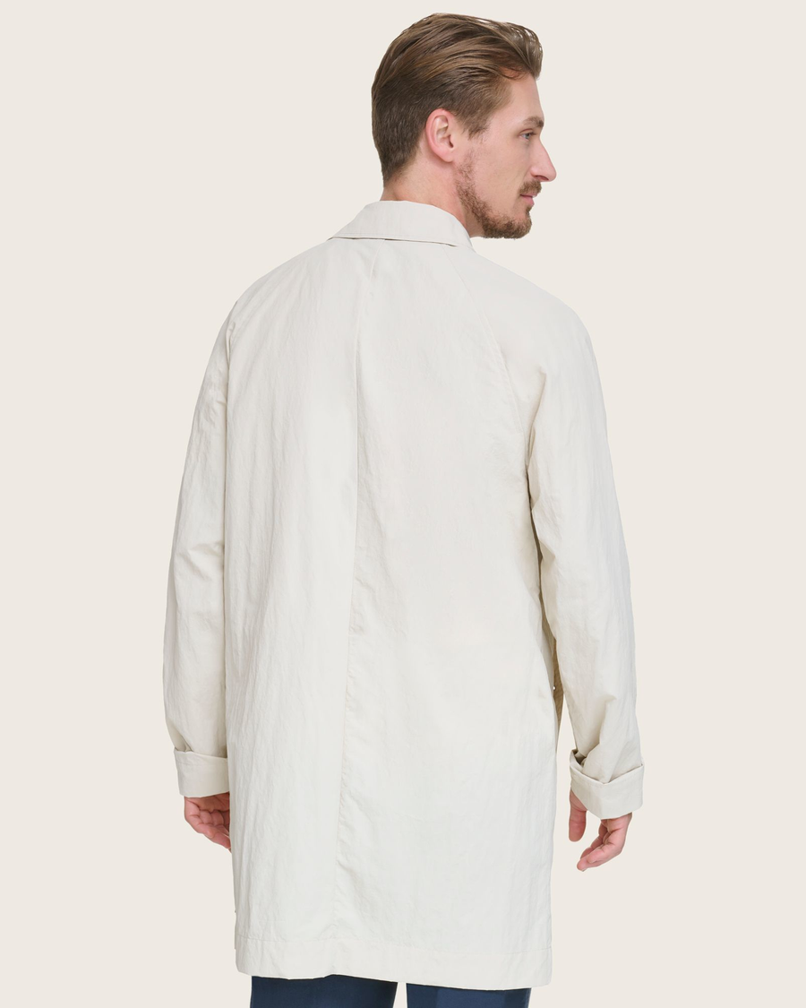 Back view of model wearing Khaki Sail Cloth Trench Coat.
