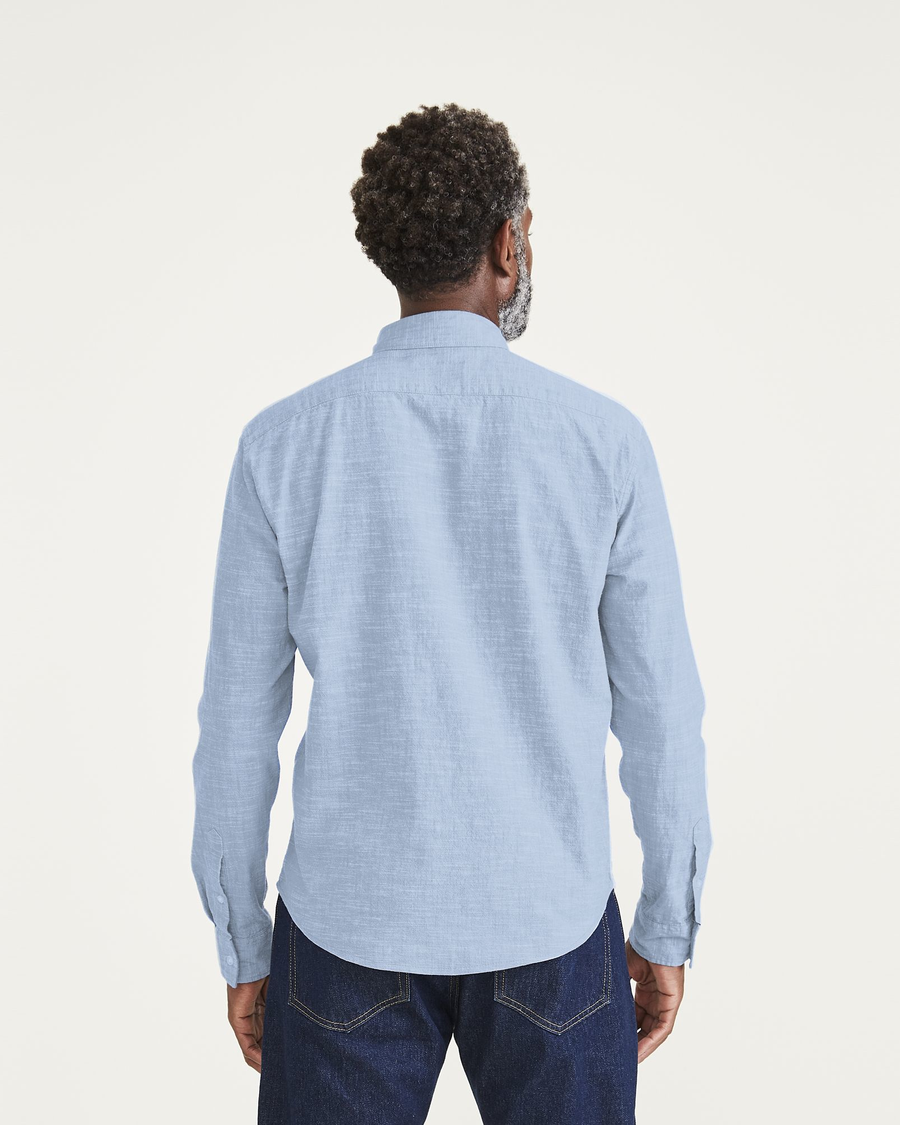 Back view of model wearing Light Blue Acid Wash Ultimate Shirt, Regular Fit.