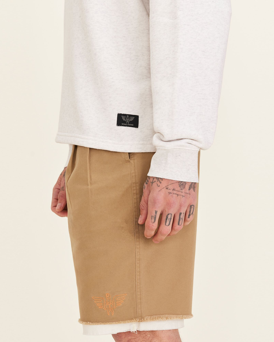 Side view of model wearing Light Heather Grey Dandois x Dockers® Mockneck Sweatshirt.