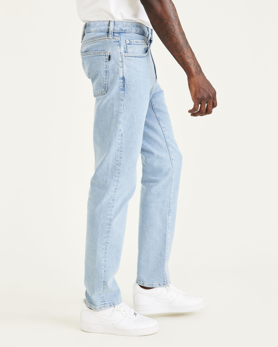 Side view of model wearing Light Indigo Stonewash Jean Cut Pants, Slim Fit.