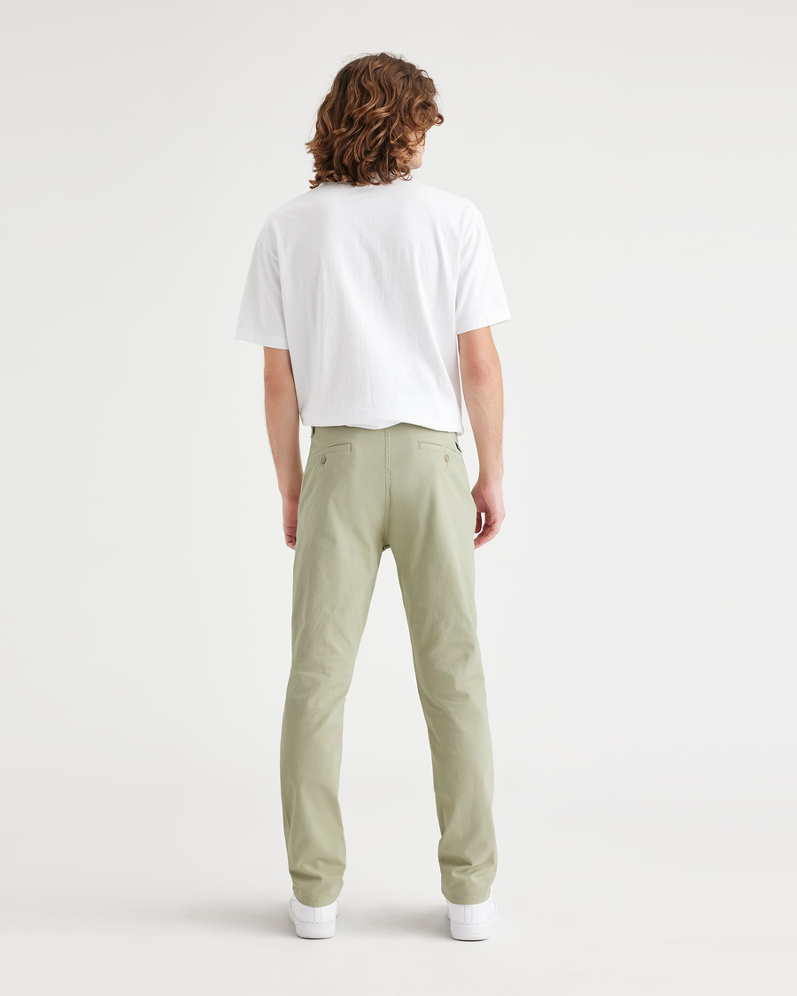 Back view of model wearing Lint Ultimate Chinos, Slim Fit.