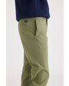 Side view of model wearing Loden Green Alpha Chino, Slim Fit.