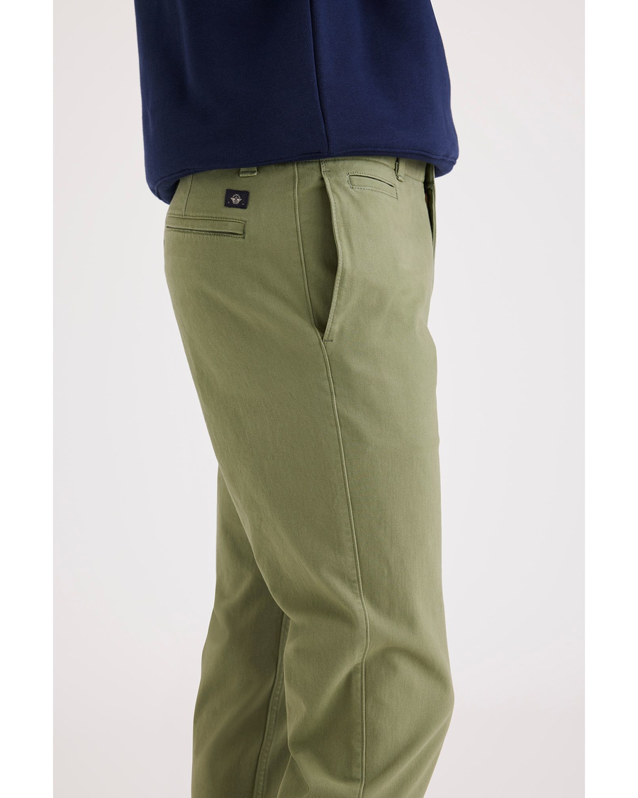 Side view of model wearing Loden Green Alpha Chino, Slim Fit.