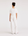 Back view of model wearing Lucent White Carpenter Pant, Straight Fit.