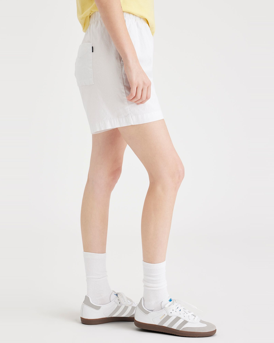 Side view of model wearing Lucent White Clay Pull-On Short.