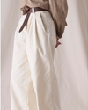 Side view of model wearing Lucent White Dockers® x Transnomadica Rigger Pant, Relaxed Fit.