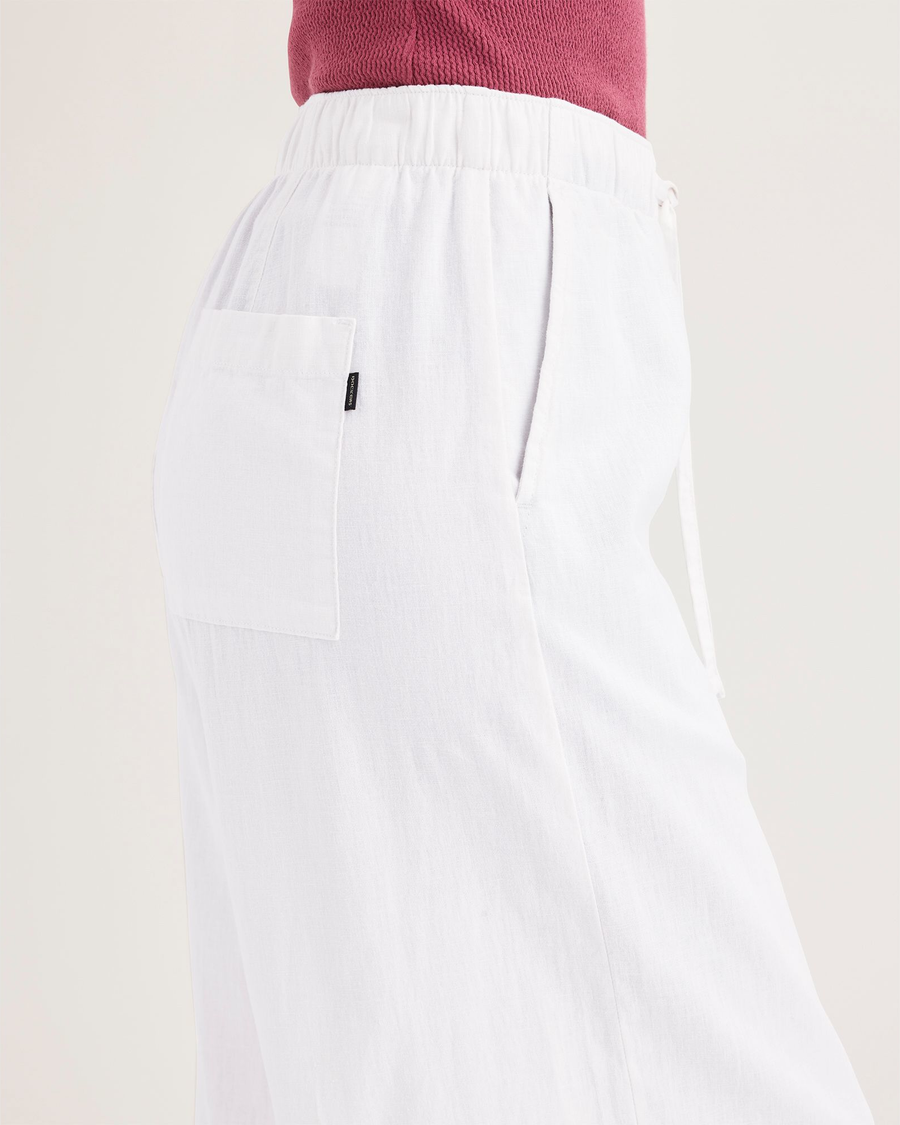Side view of model wearing Lucent White Drawstring Pant, Regular Fit.