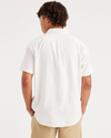 Back view of model wearing Lucent White Original Button Up, Regular Fit.