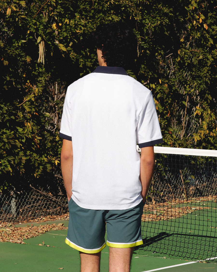 View of model wearing Lucent White Racquet Club Polo, Regular Fit.