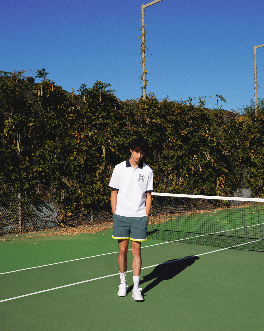 View of model wearing Lucent White Racquet Club Polo, Regular Fit.