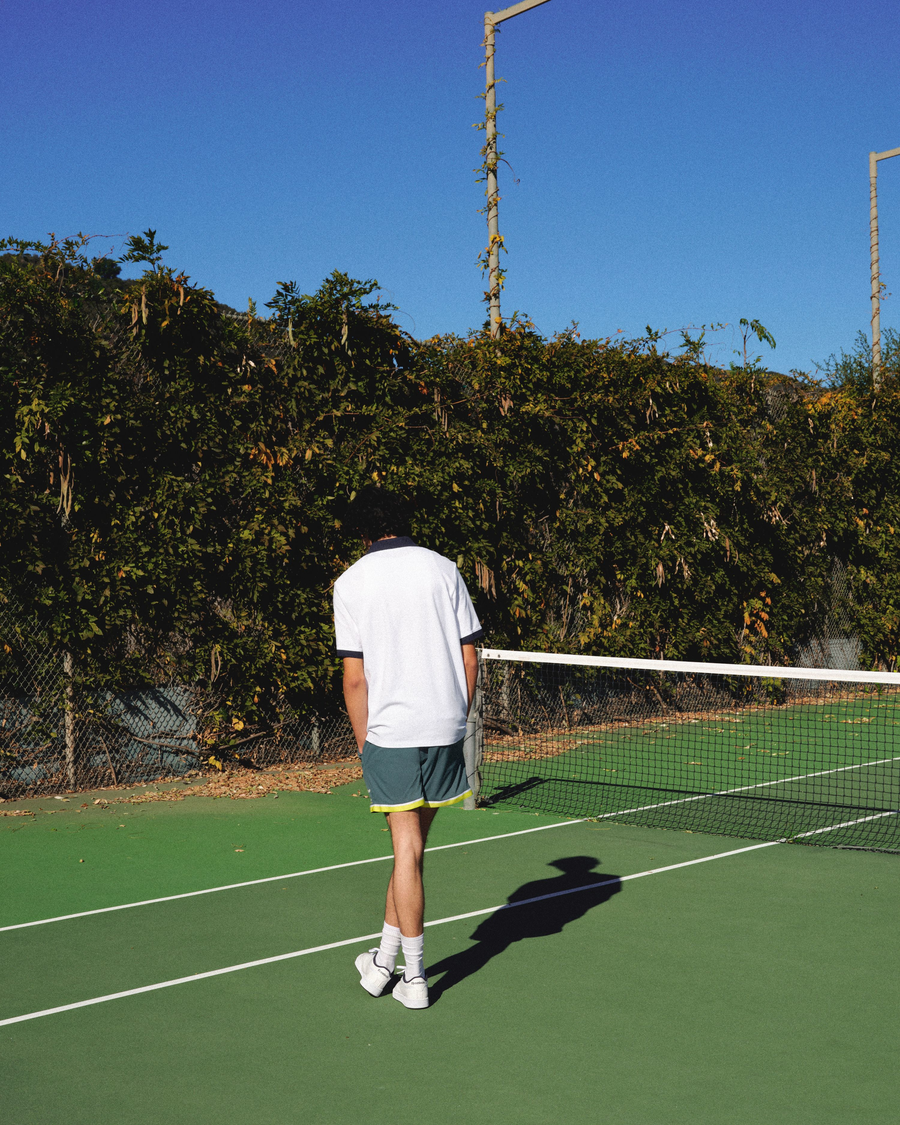 View of model wearing Lucent White Racquet Club Polo, Regular Fit.