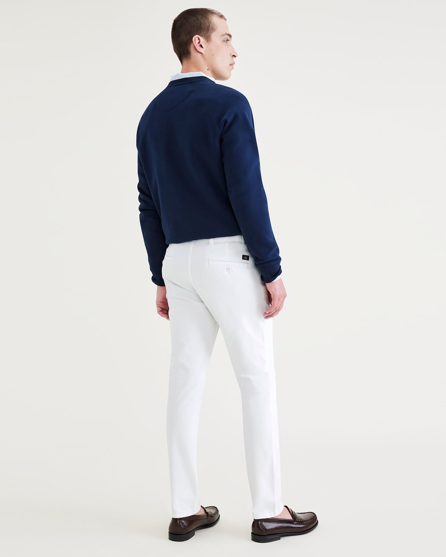 Back view of model wearing Lucent White Ultimate Chinos, Skinny Fit.