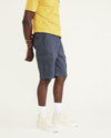 Side view of model wearing Maritime Blue Perfect Cargo 10.5" Shorts, Straight Fit.