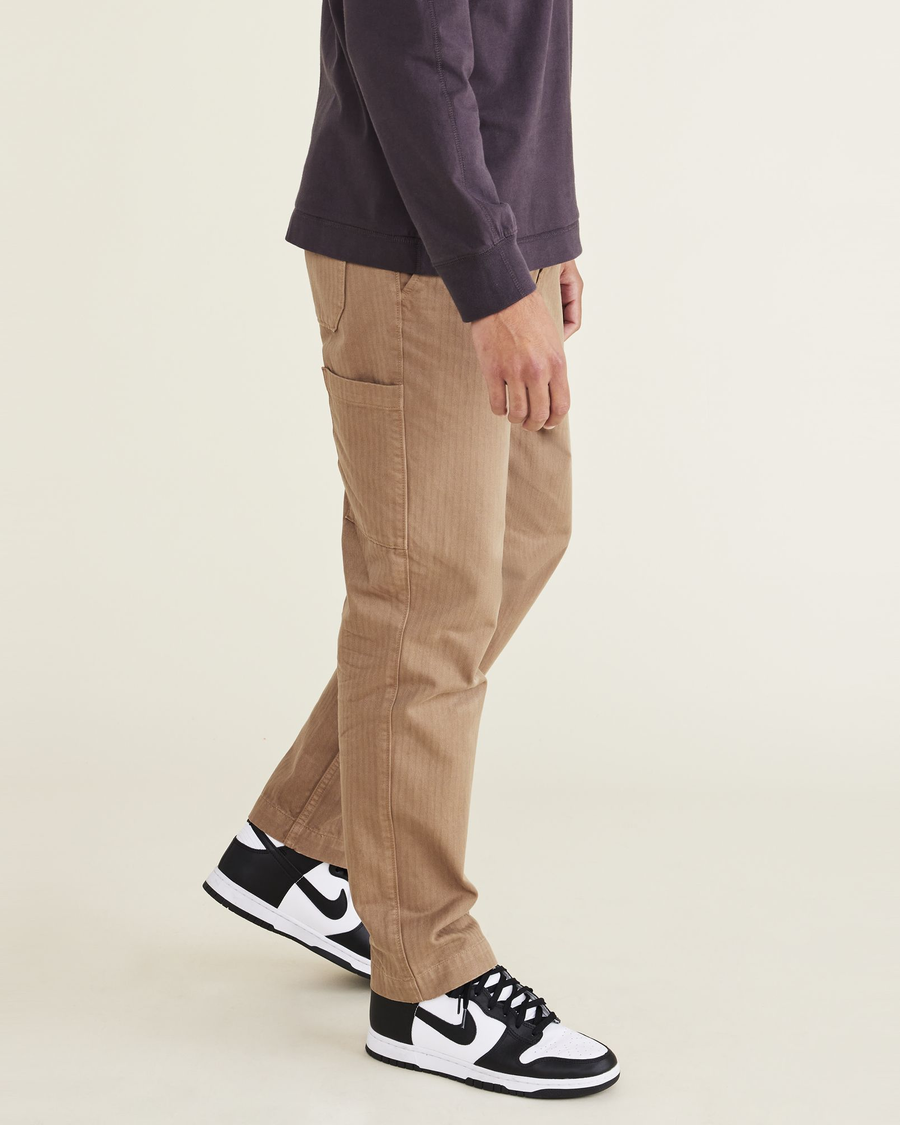 Side view of model wearing Medium Brown California Carpenter Pants, Straight Fit.