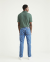 Back view of model wearing Medium Indigo Stonewash Jean Cut Pants, Straight Fit.