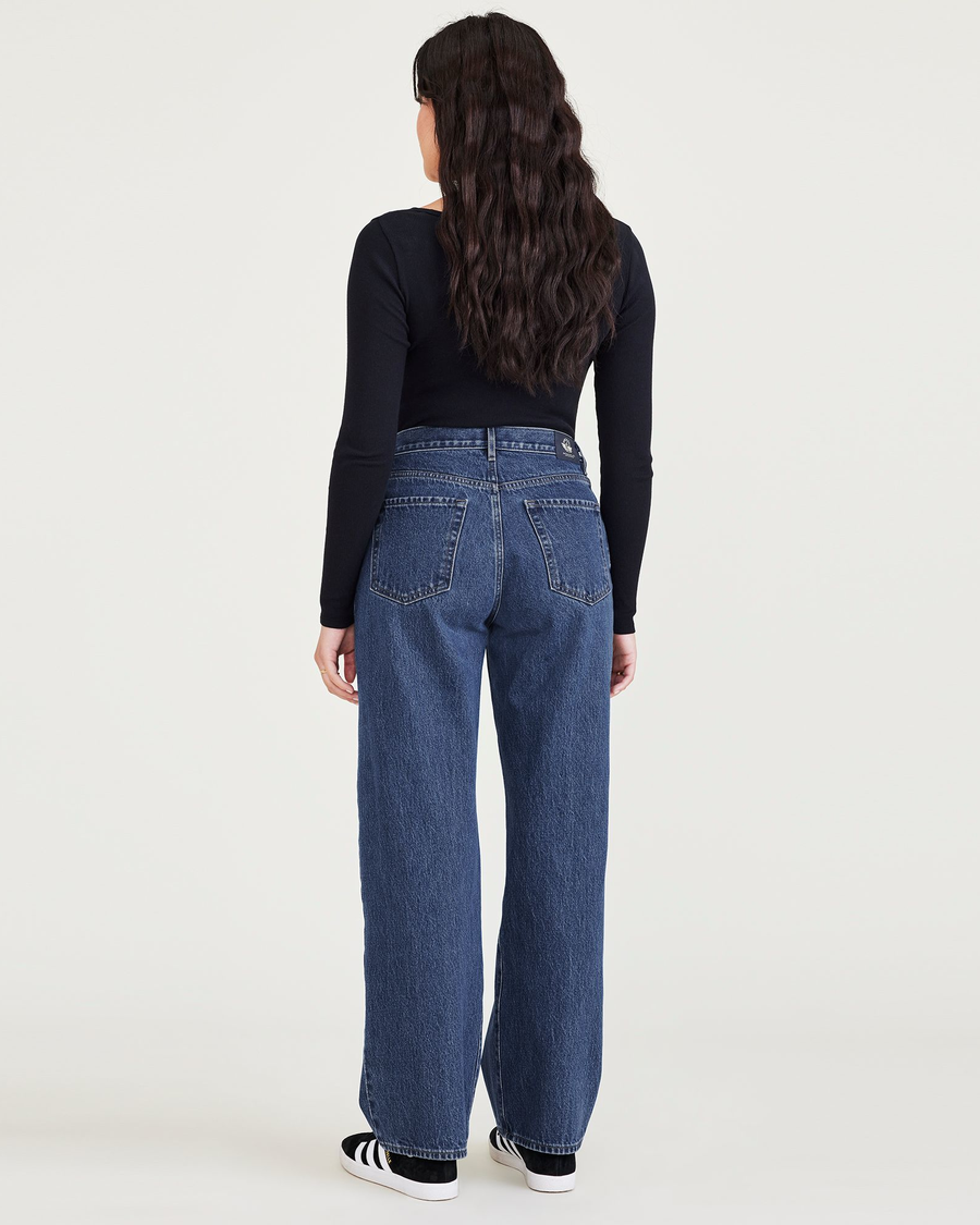 Back view of model wearing Medium Indigo Stonewash Mid-Rise Jeans, Relaxed Fit.