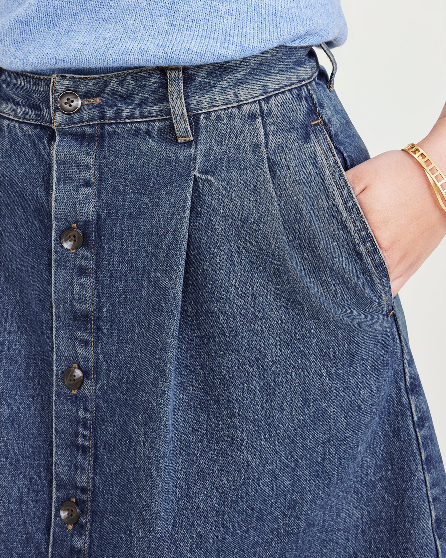 View of model wearing Medium Indigo Stonewash Midi Skirt.