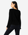 Back view of model wearing Mineral Black Bell Sleeve Sweater.