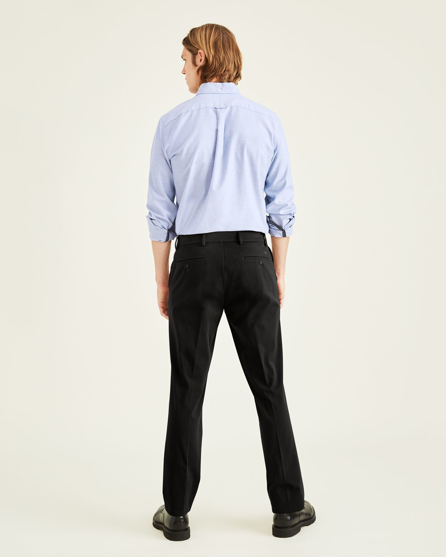 Back view of model wearing Mineral Black City Tech Trousers, Slim Fit.