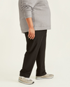 Side view of model wearing Mineral Black Comfort Knit Chinos, Straight Fit (Big and Tall).