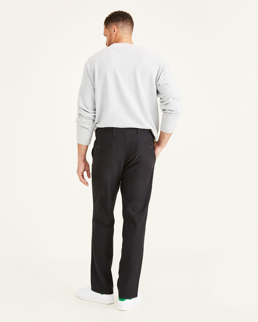 Back view of model wearing Mineral Black Comfort Knit Chinos, Straight Fit.