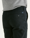 View of model wearing Mineral Black Original Chinos, Straight Fit.