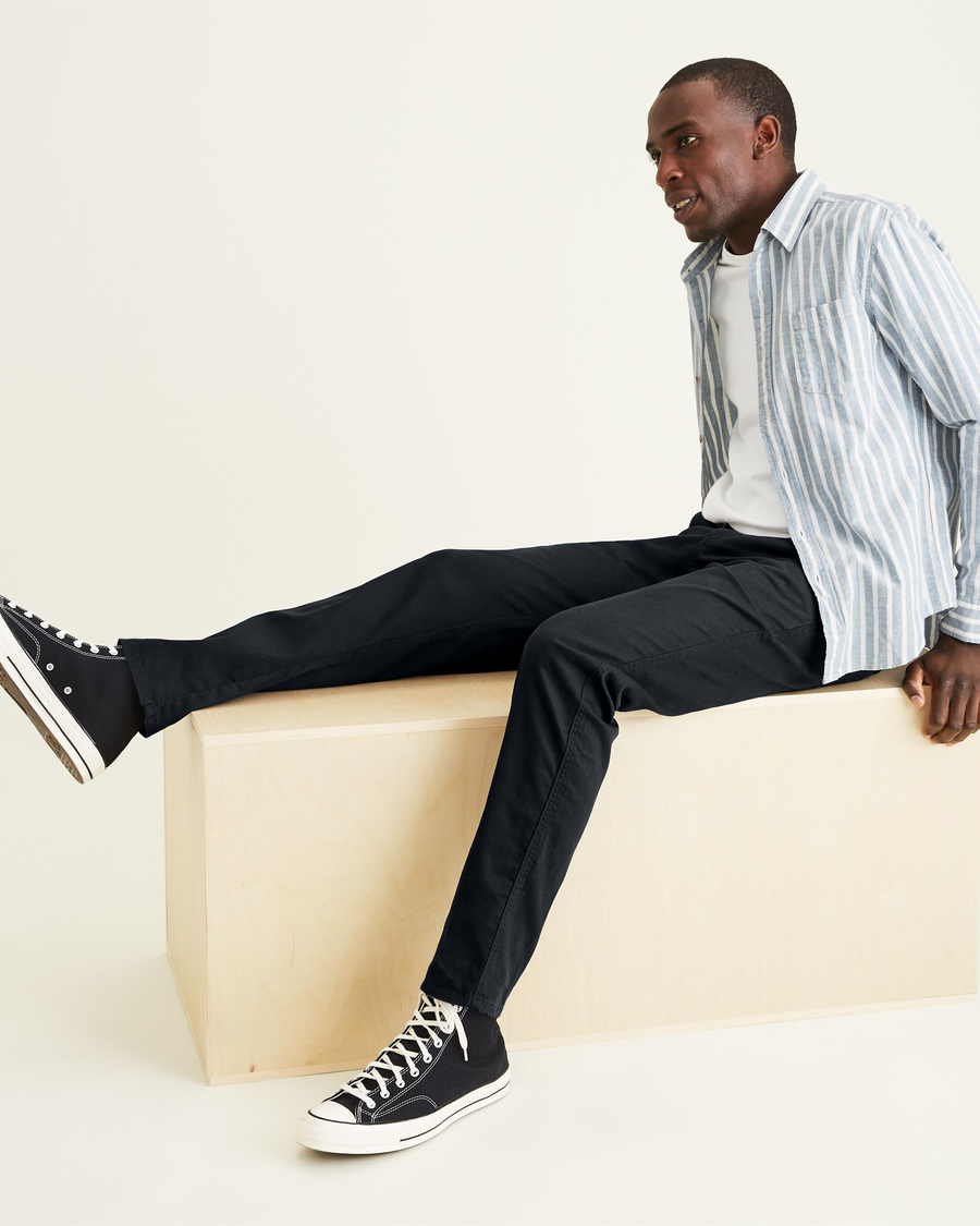 View of model wearing Mineral Black Original Chinos, Straight Tapered Fit.