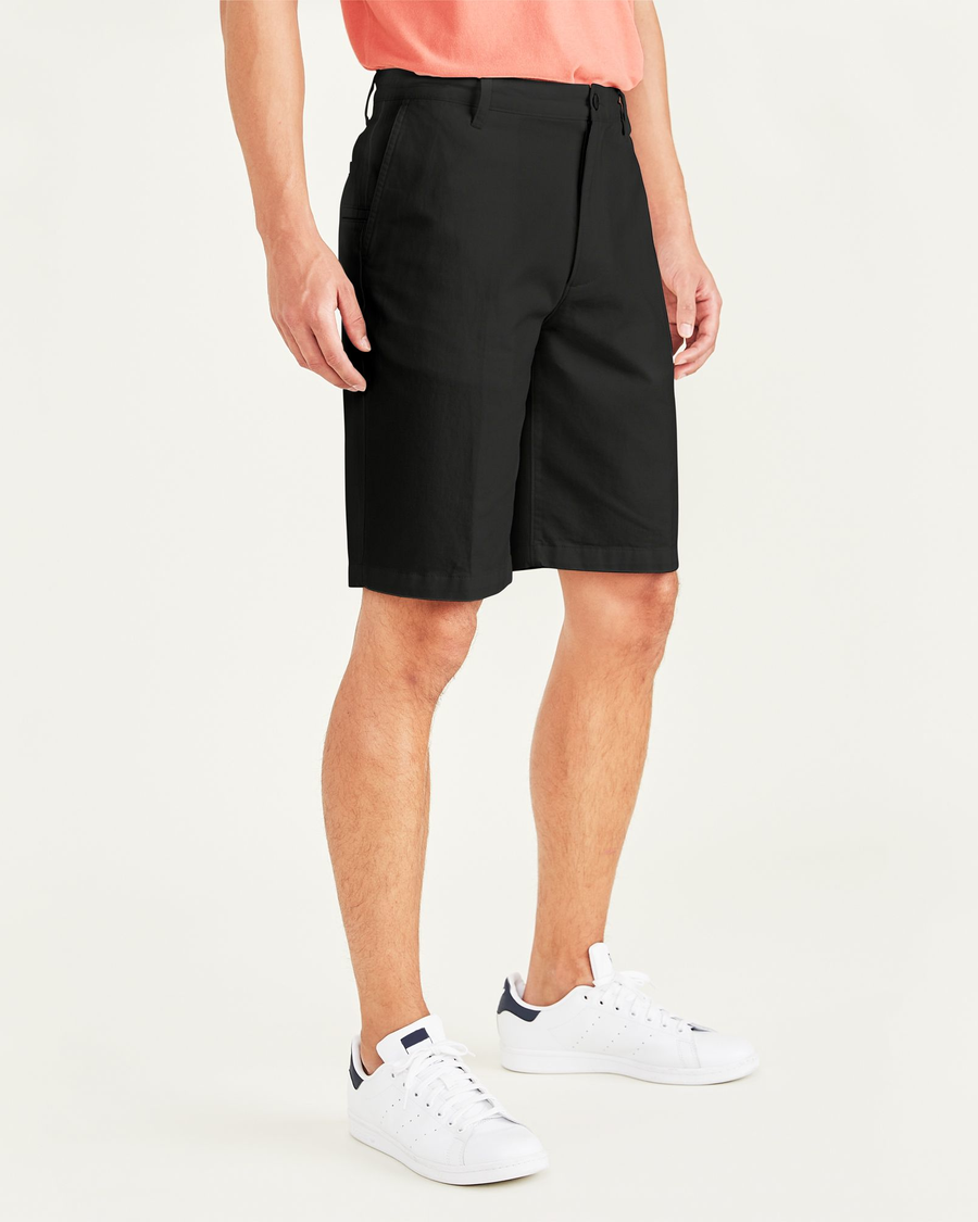 Side view of model wearing Mineral Black Perfect 10.5" Shorts.
